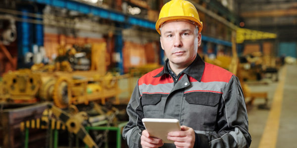 A factory supervisor monitors the vibrations in his equipment using an IoT vibration sensor.