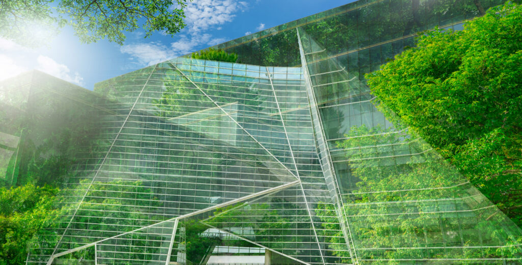 A sustainable building connected by IoT with trees surrounding it.