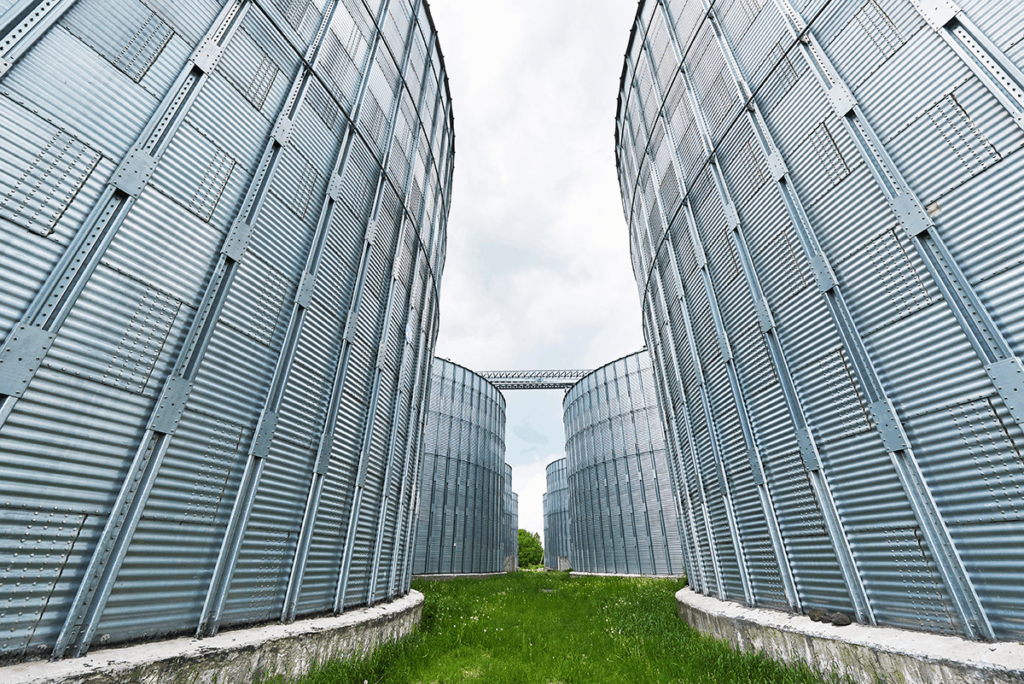 Silos contain grain monitoring by IoT in Agriculture solutions.