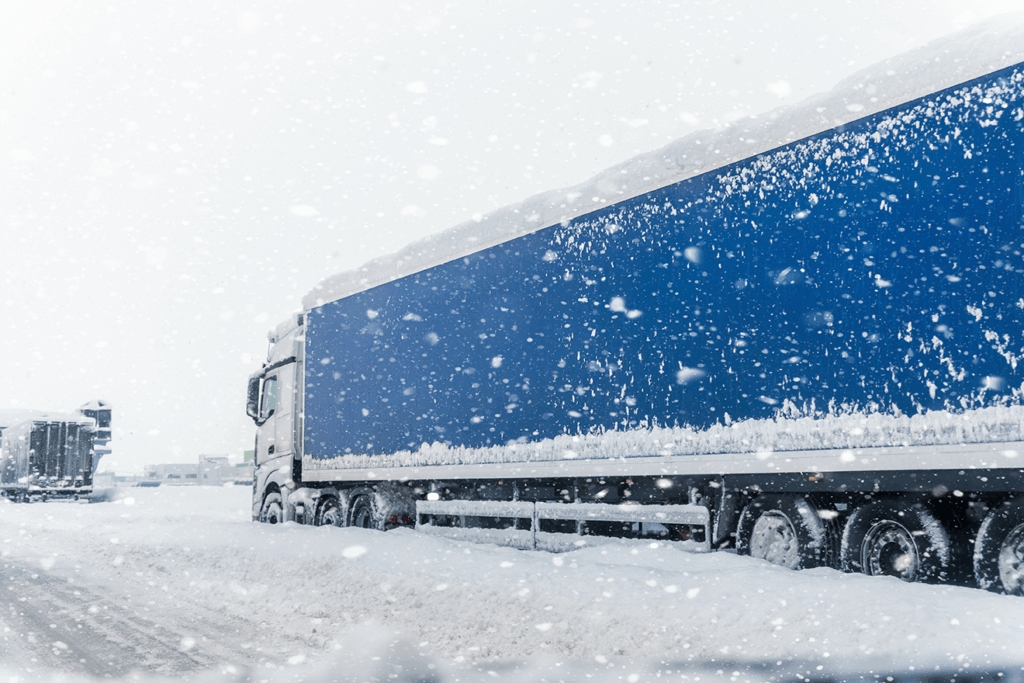 A tractor-trailer being monitored by IoT gets stuck in the snow.
